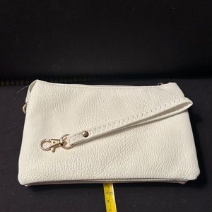 White clutch with numerous pocket’s for orgsnizing.